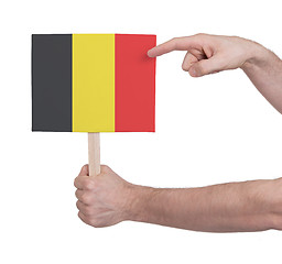 Image showing Hand holding small card - Flag of Belgium