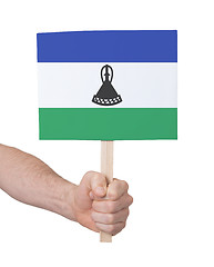 Image showing Hand holding small card - Flag of Lesotho