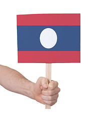 Image showing Hand holding small card - Flag of Laos