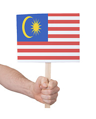 Image showing Hand holding small card - Flag of Malaysia