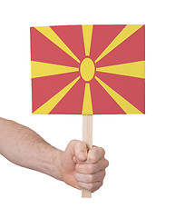 Image showing Hand holding small card - Flag of Macedonia