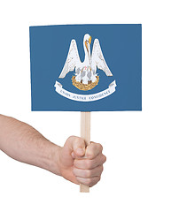 Image showing Hand holding small card - Flag of Louisiana
