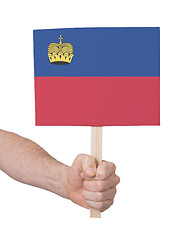 Image showing Hand holding small card - Flag of Liechtenstein