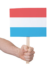 Image showing Hand holding small card - Flag of Luxembourg
