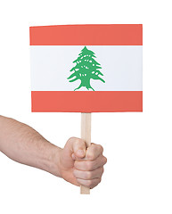 Image showing Hand holding small card - Flag of Lebanon