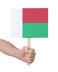 Image showing Hand holding small card - Flag of Madagascar