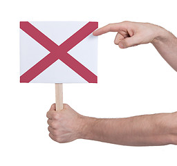 Image showing Hand holding small card - Flag of Alabama