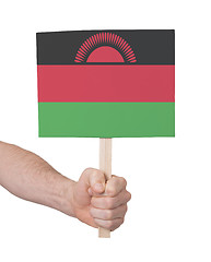 Image showing Hand holding small card - Flag of Malawi