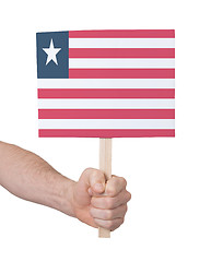 Image showing Hand holding small card - Flag of Liberia