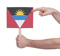 Image showing Hand holding small card - Flag of Antigua and Barbuda