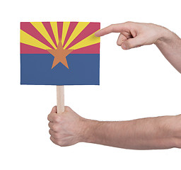 Image showing Hand holding small card - Flag of Arizona