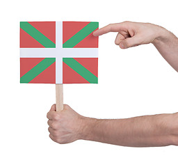 Image showing Hand holding small card - Flag of Basque Country