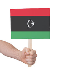 Image showing Hand holding small card - Flag of Libya