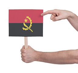 Image showing Hand holding small card - Flag of Angola