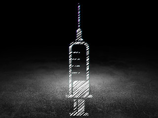 Image showing Health concept: Syringe in grunge dark room
