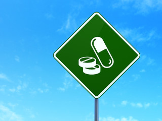 Image showing Health concept: Pills on road sign background