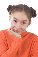 Image showing Happy girl with hands on chin