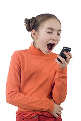 Image showing Young girl yelling into cellphone