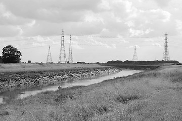 Image showing Overhead power lines span the River Nene in Cambridgeshire