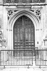 Image showing parliament in london old church door and marble antique  wall