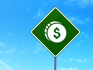 Image showing Currency concept: Dollar Coin on road sign background