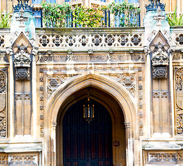 Image showing parliament in london old church door and marble antique  wall