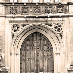 Image showing parliament in london old church door and marble antique  wall