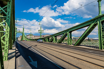 Image showing The green Freedom Bridge, with yellow tram, in Budapest,the capi