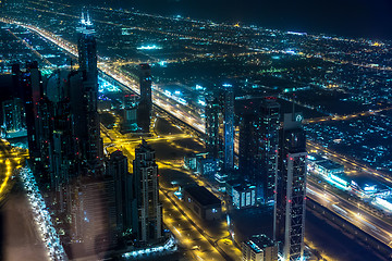 Image showing Dubai downtown night scene with city lights,