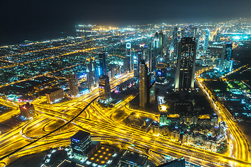 Image showing Dubai downtown night scene with city lights,