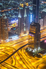 Image showing Dubai downtown night scene with city lights,