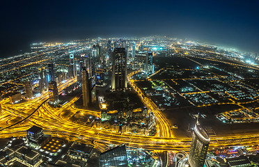 Image showing Dubai downtown night scene with city lights,