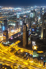 Image showing Dubai downtown night scene with city lights,