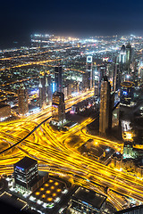 Image showing Dubai downtown night scene with city lights,