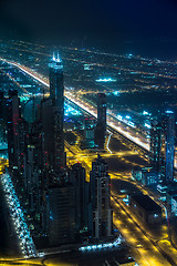 Image showing Dubai downtown night scene with city lights,