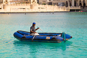 Image showing Workers in uniform are cleaning pool