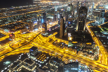 Image showing Dubai downtown night scene with city lights,