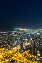 Image showing Dubai downtown night scene with city lights,