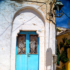 Image showing blue door in antique village santorini greece europe and    whit