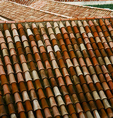 Image showing minaret old moroccan  tile roof in the old city 