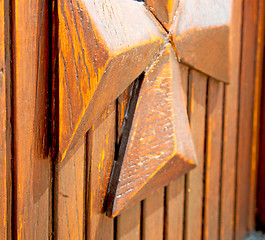 Image showing grain texture of a brown antique wooden old door in italy   euro