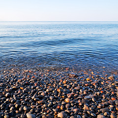 Image showing stone in the coastline sunrise and light ocean white sky