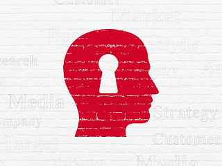 Image showing Advertising concept: Head With Keyhole on wall background