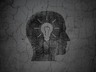 Image showing Learning concept: Head With Light Bulb on grunge wall background