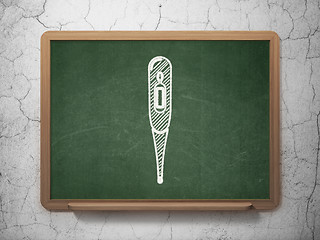 Image showing Health concept: Thermometer on chalkboard background