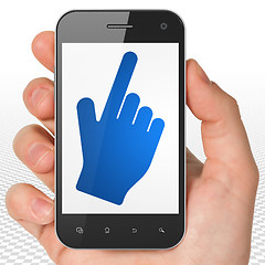 Image showing Social network concept: Hand Holding Smartphone with Mouse Cursor on display