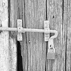 Image showing europe old in  italy  antique close brown door and rusty lock  c