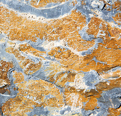 Image showing rocks stone and red orange gneiss in the wall of morocco