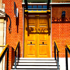 Image showing brown wooden parliament in london old  door and marble antique  