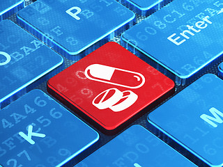 Image showing Medicine concept: Pills on computer keyboard background